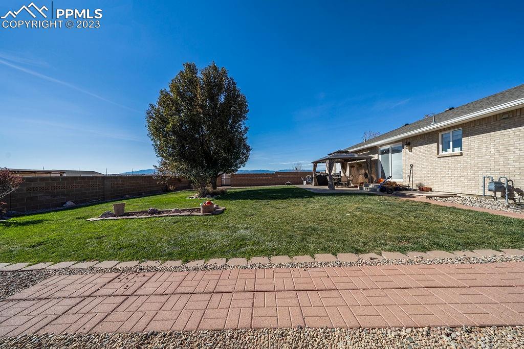 648 South McCulloch Boulevard Pueblo, CO 81007 - Photo 49 of 50 a front view of a house with garden