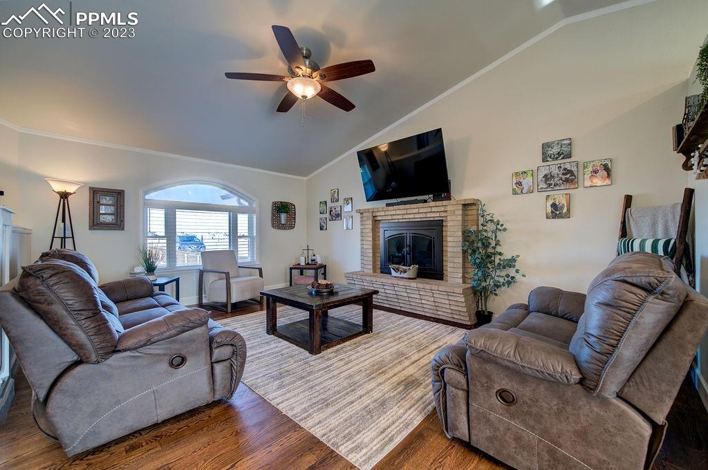 648 South McCulloch Boulevard Pueblo, CO 81007 - Photo 6 of 50 a living room with furniture a fireplace and a flat screen tv