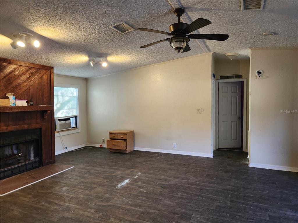 2608 20 Mile Level Road Land O' Lakes, FL 34639 - Photo 14 of 19 a view of a livingroom with a fireplace