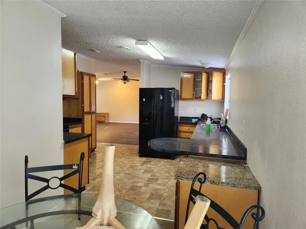 a kitchen with refrigerator and window