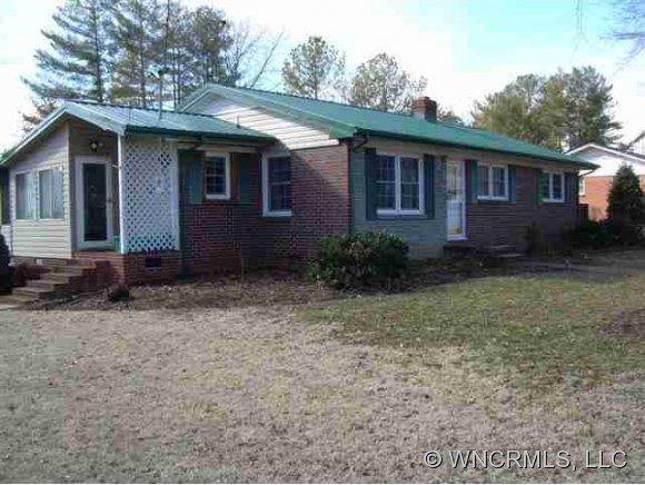 139 Crestview Street Rutherfordton, NC 28139 - Photo 1 of 6 a view of a house with a yard
