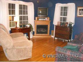 139 Crestview Street Rutherfordton, NC 28139 - Photo 3 of 6 a living room with furniture window and a fireplace