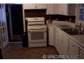 139 Crestview Street Rutherfordton, NC 28139 - Photo 6 of 6 a kitchen with a stove and a microwave