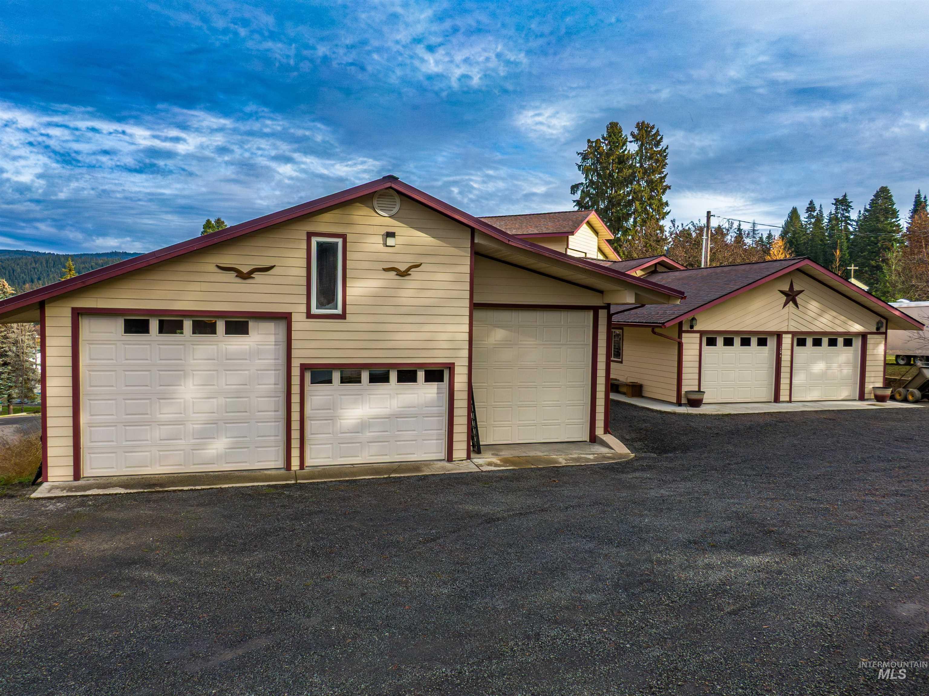 204 South 2nd Street Elk River, ID 83827 - Photo 43 of 50 3 Bay doors, drive through door, 9,000 lb vehicle lift, wood stove, bathroom, loft storage, lean-to firewood storage.