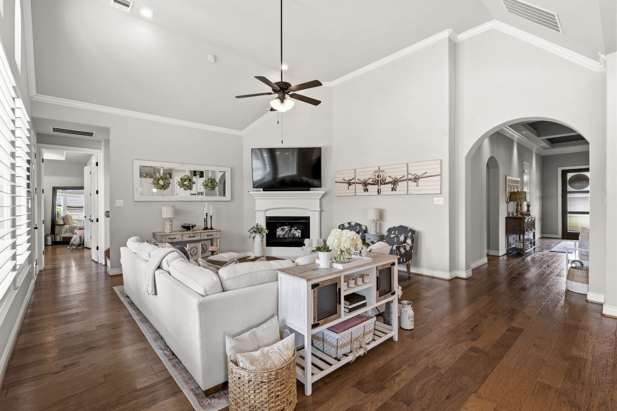 14012 Beartooth Bend Trail Conroe, TX 77384 - Photo 11 of 50 The inviting family room is anchored by a stately corner cast stone fireplace that adds warmth, character, and timeless sophistication. The custom gas logs were added in 2020. There is also exterior access to the back yard, easily enhancing your outdoor entertaining options. Blending timeless sophistication with modern functionality, every detail has been carefully curated to deliver an unparalleled living experience.