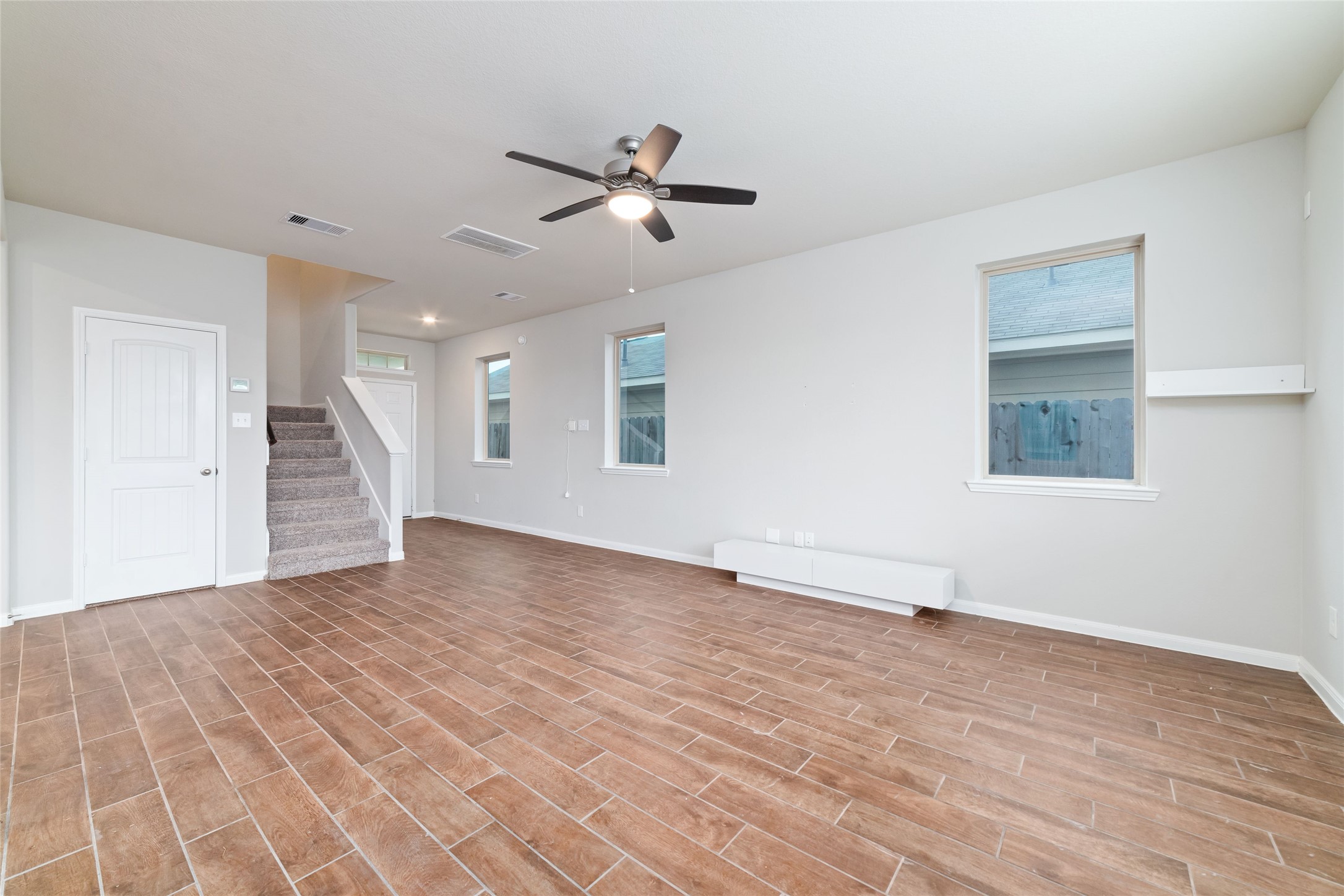 21622 Buttonsage Lane Katy, TX 77449 - Photo 7 of 17 wooden floor in an empty room with a window