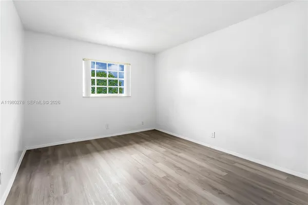 a close view of a closet with a potted plant on the wall