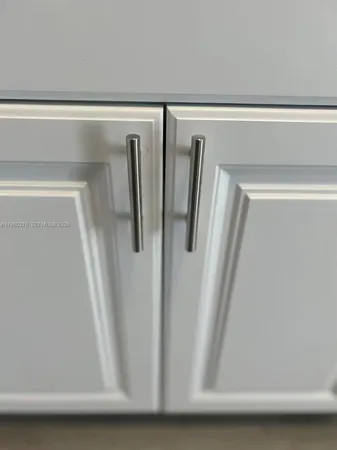 a view of a backyard with table and chairs