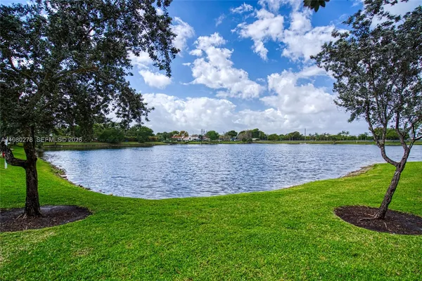 a swimming pool with outdoor seating and yard