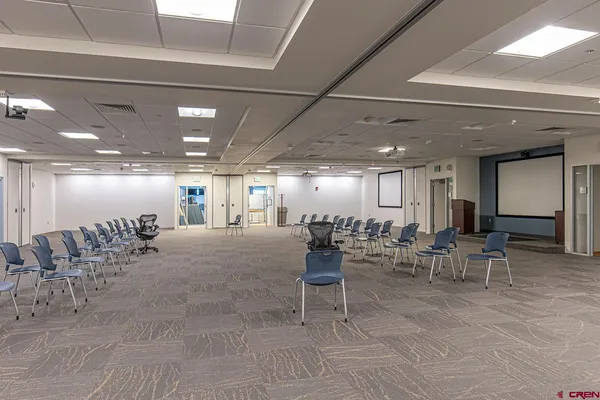 a large room with gym equipment