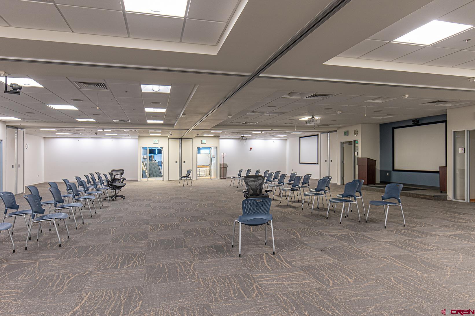 380 Airport Road Ignacio, CO 81137 - Photo 12 of 25 a room with lots of tables a chairs and a potted plant