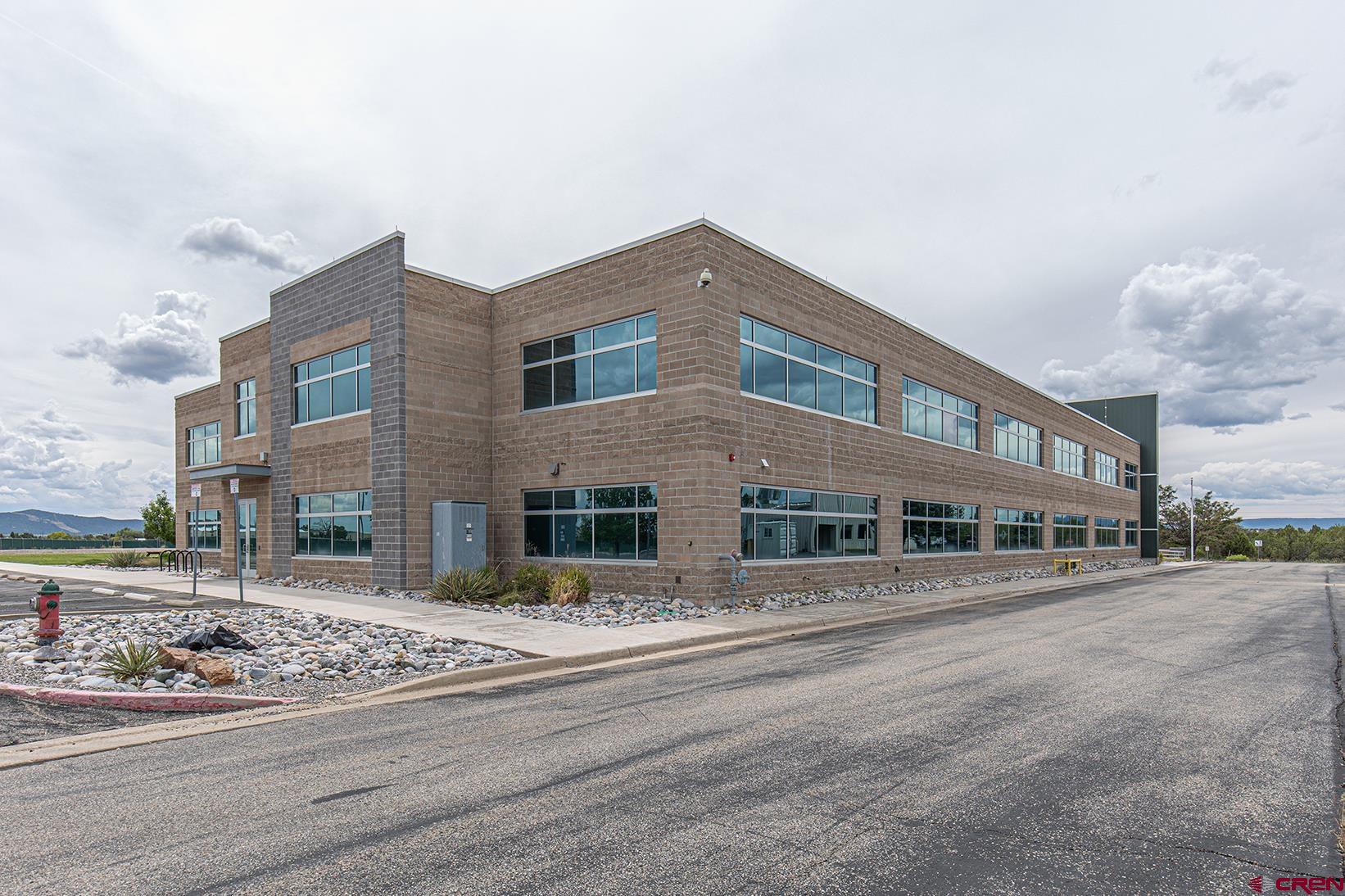 380 Airport Road Ignacio, CO 81137 - Photo 2 of 25 a front view of a building with street