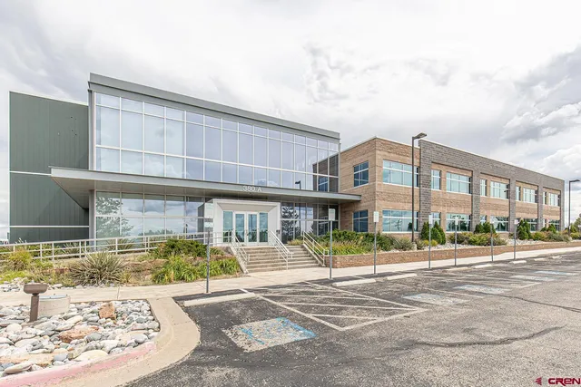 a front view of a building with street view