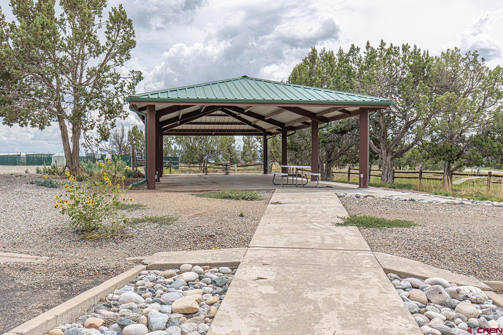 380 Airport Road Ignacio, CO 81137 - Photo 5 of 25 a view of patio with a table and chairs under an umbrella