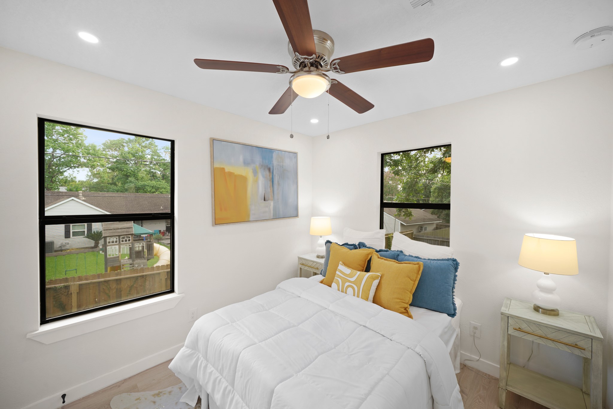 4813 Hummingbird Street Houston, TX 77035 - Photo 28 of 50 The Second Floor Fourth Bedroom (South Wing) offers Light Weathered Wood Wide Plank Engineered Floors and a Contemporary Style Ceiling Fan with Polished Nickel Accent and Light. Also featured is a Walk in Closet (Approximately 5'10" x 5'1) with Light Weathered Wood Wide Plank Engineered Floors, Wrap Around Built in Shelf, Multiple Hanging Rods, and LED Flush Mount.
