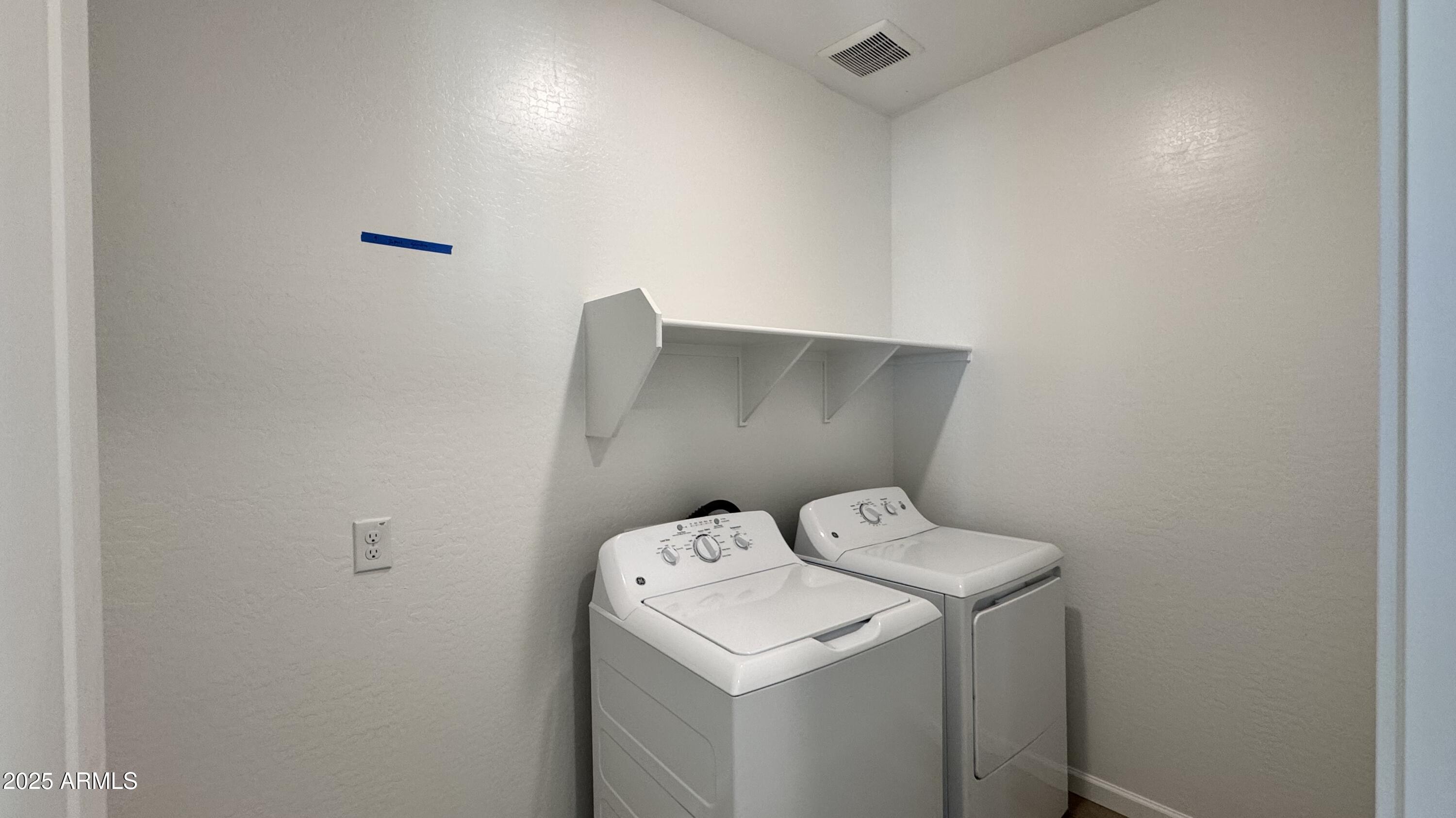 15748 West Camden Avenue Waddell, AZ 85355 - Photo 11 of 36 a utility room with dryer and washer