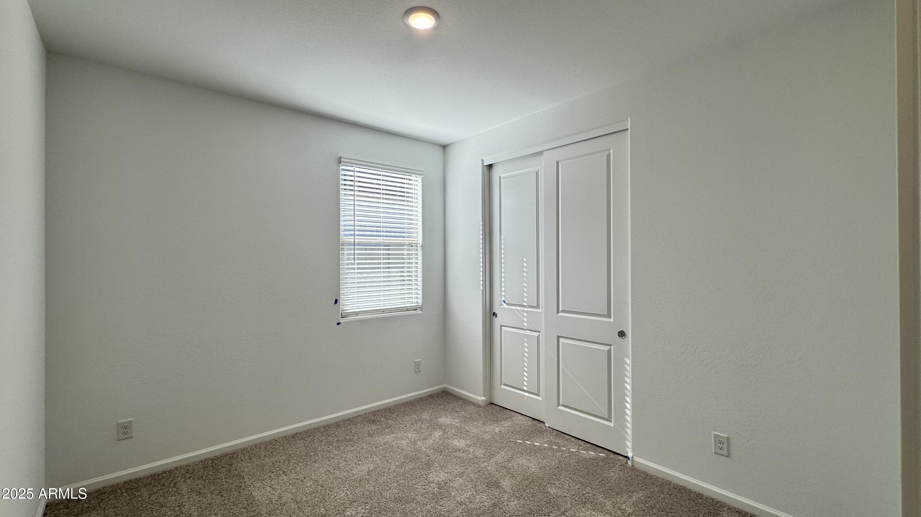 15748 West Camden Avenue Waddell, AZ 85355 - Photo 13 of 36 an empty room with windows
