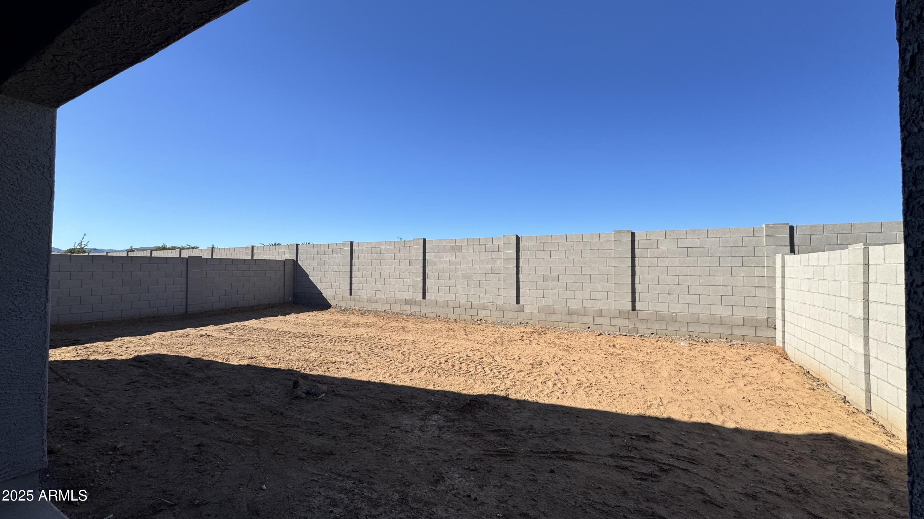 15748 West Camden Avenue Waddell, AZ 85355 - Photo 16 of 36 a view of a backyard of the house