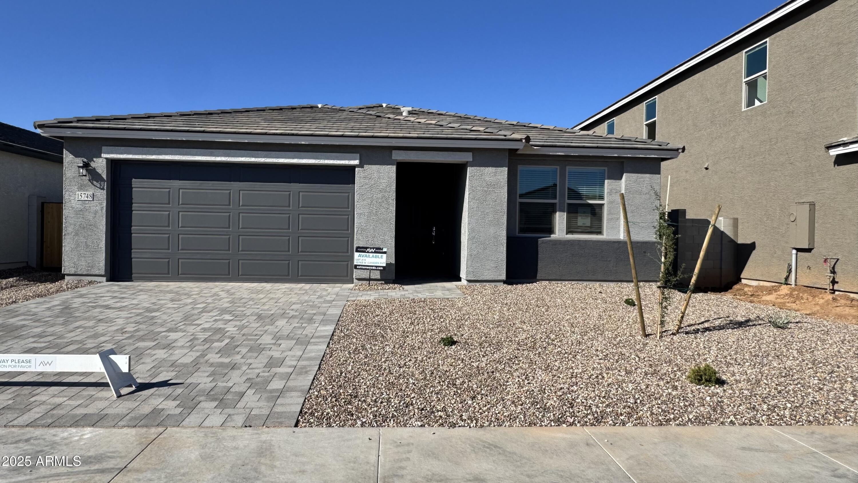 15748 West Camden Avenue Waddell, AZ 85355 - Photo 2 of 36 a front view of a house