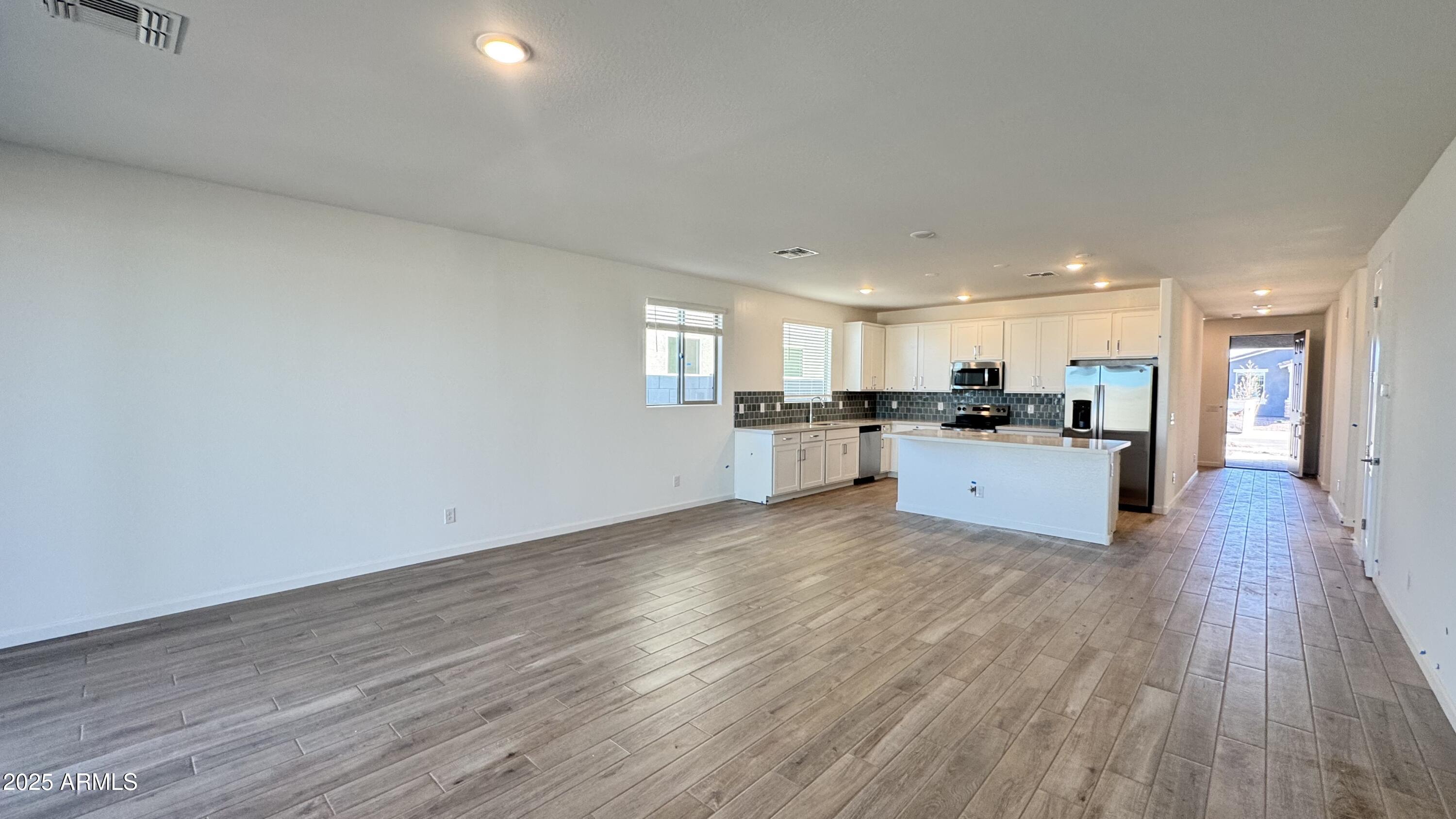 15748 West Camden Avenue Waddell, AZ 85355 - Photo 10 of 36 a view of kitchen with wooden floor