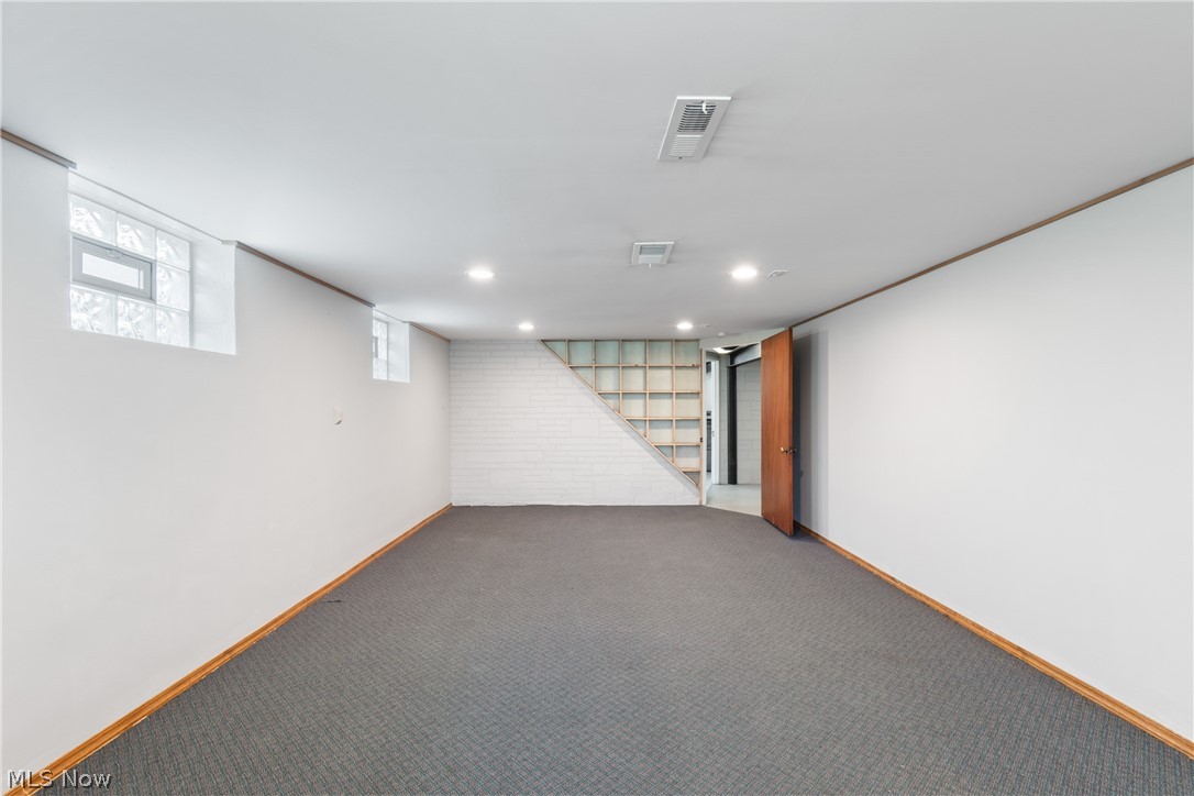 10876 West Sprague Road Cleveland, OH 44130 - Photo 18 of 31 Basement featuring brick wall and dark carpet