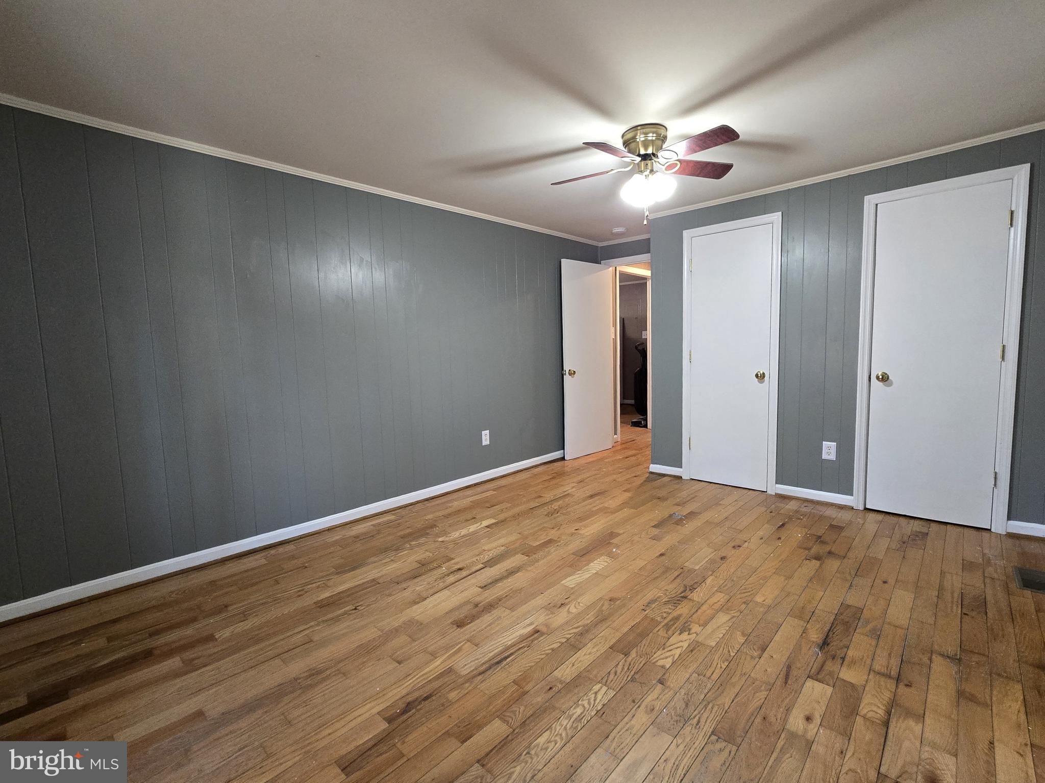 803 Tomahawk Trail Winchester, VA 22602 - Photo 11 of 20 a view of an empty room with wooden floor