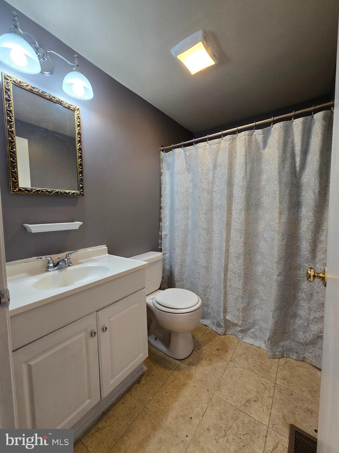 803 Tomahawk Trail Winchester, VA 22602 - Photo 13 of 20 a bathroom with a toilet sink and mirror