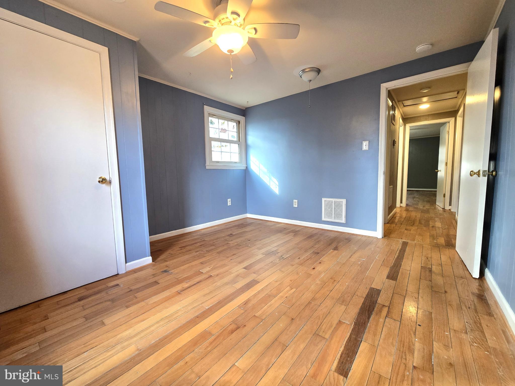 803 Tomahawk Trail Winchester, VA 22602 - Photo 15 of 20 a view of empty room with wooden floor