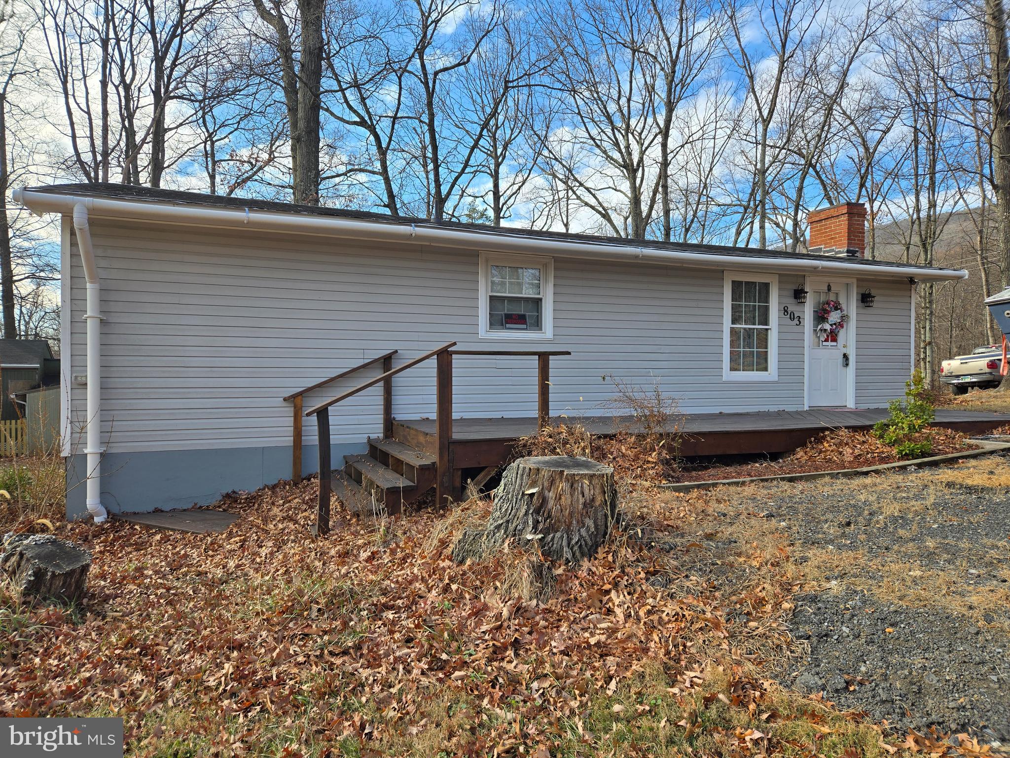 803 Tomahawk Trail Winchester, VA 22602 - Photo 2 of 20 a backyard of a house with table and chairs