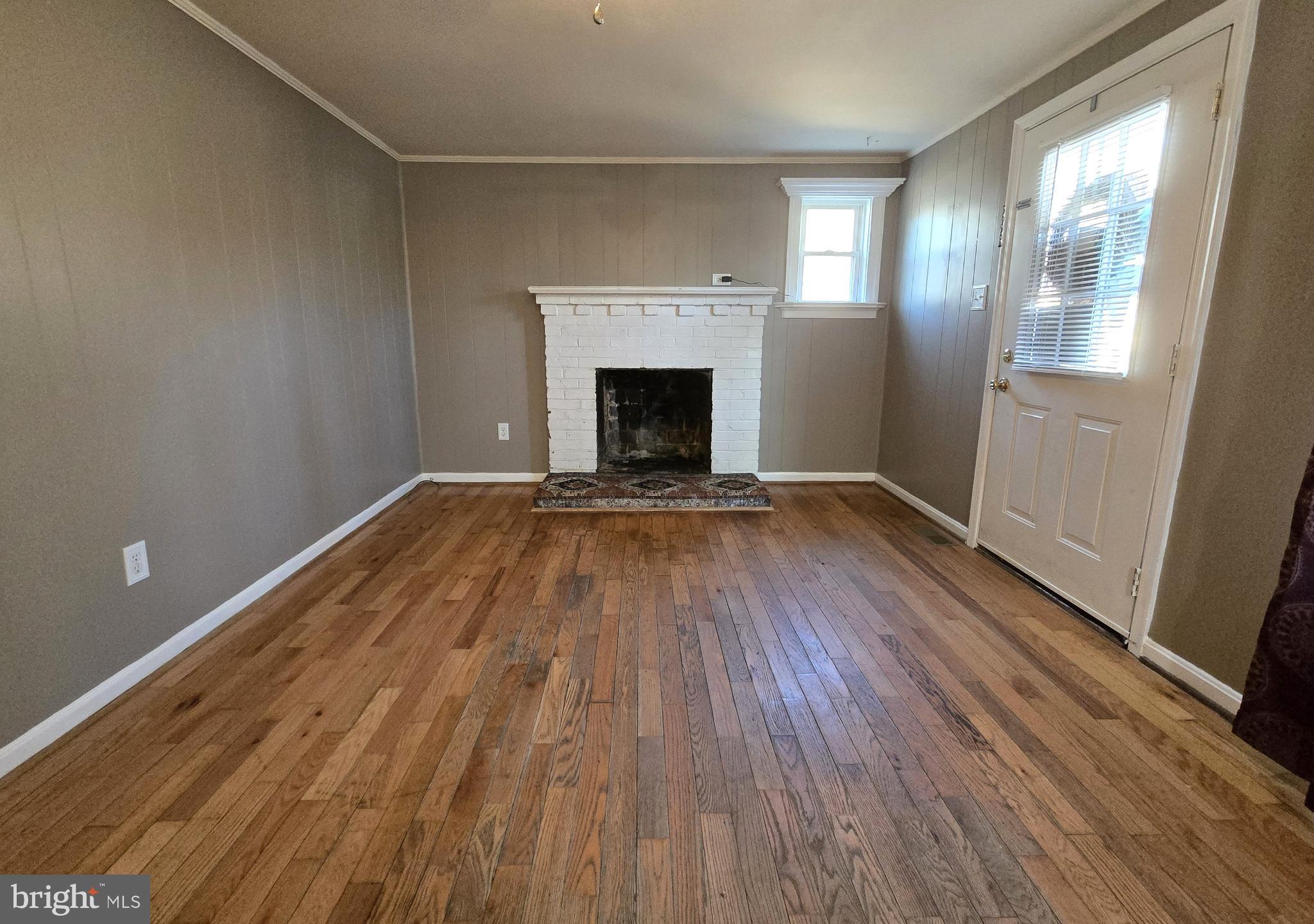 803 Tomahawk Trail Winchester, VA 22602 - Photo 5 of 20 wooden floor fireplace and natural light in room