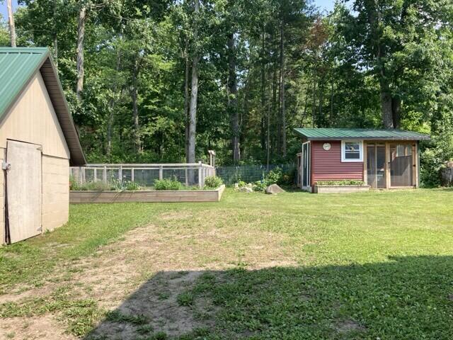 7065 Cousineau Road Lachine, MI 49753 - Photo 21 of 23 Chicken coop and shed