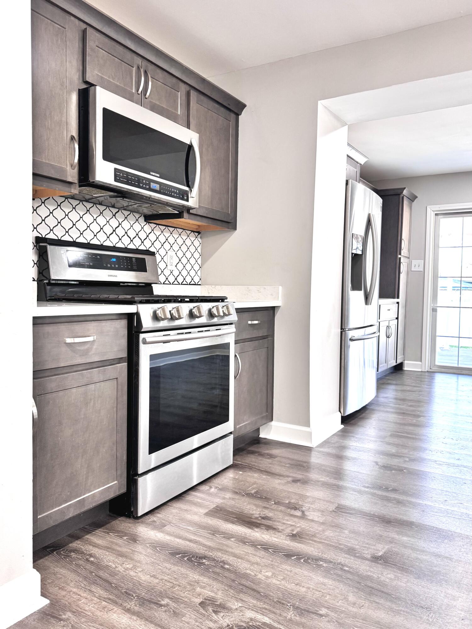 3429 42nd Street Highland, IN 46322 - Photo 11 of 42 a kitchen with a stove and a microwave