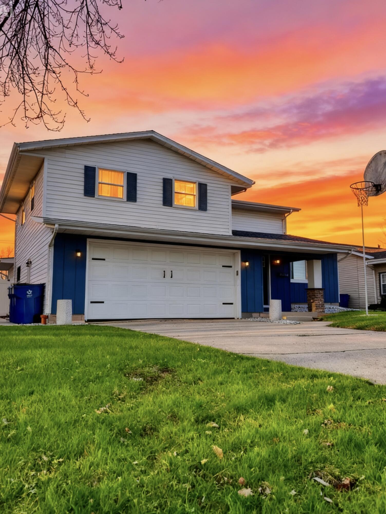 3429 42nd Street Highland, IN 46322 - Photo 2 of 42 a front view of a house with a yard and table and chairs