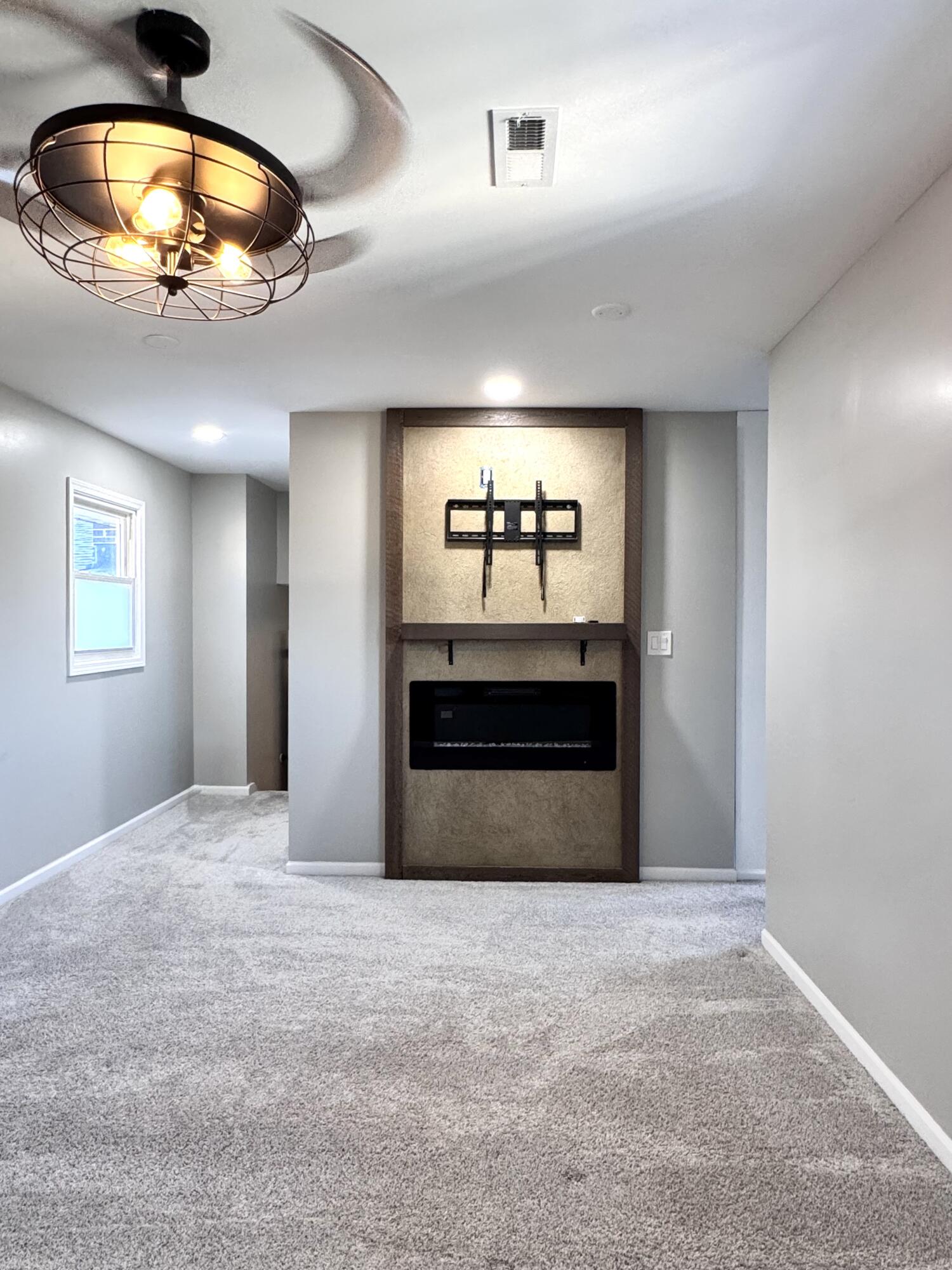 3429 42nd Street Highland, IN 46322 - Photo 22 of 42 an empty room with a ceiling fan and window