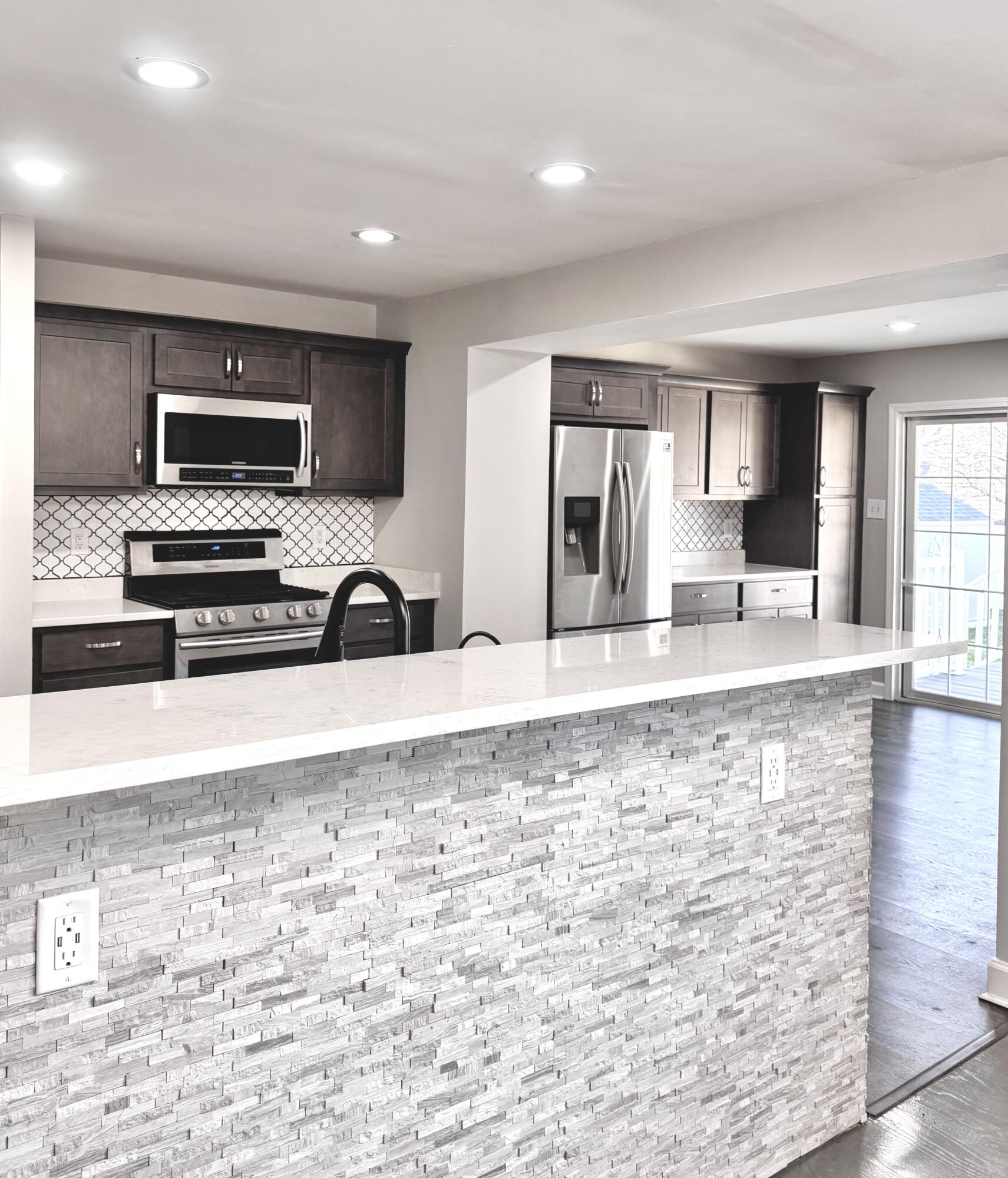 3429 42nd Street Highland, IN 46322 - Photo 8 of 42 a view of kitchen with kitchen island microwave and stove top oven