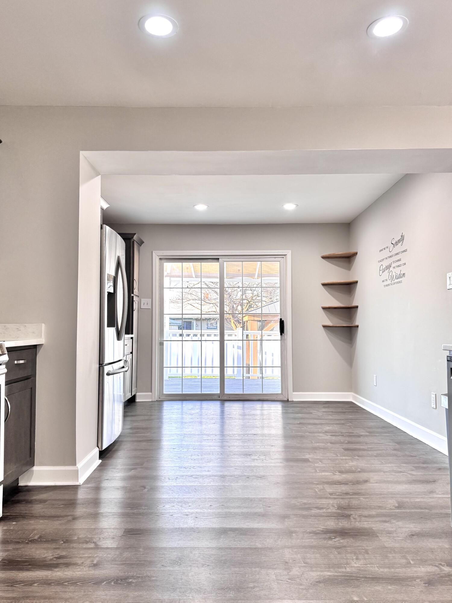 3429 42nd Street Highland, IN 46322 - Photo 9 of 42 a view of an empty room with a window and wooden floor