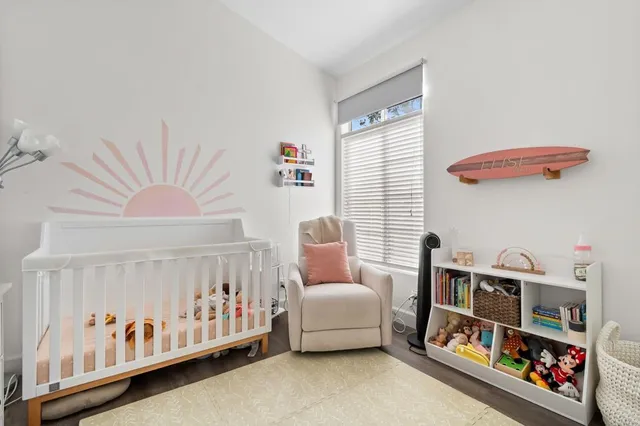 a bedroom with furniture and a window