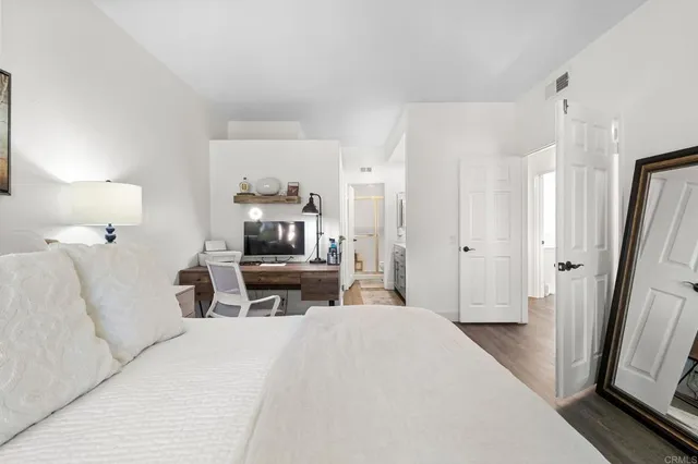 a bathroom with double vanity sinks and two mirror