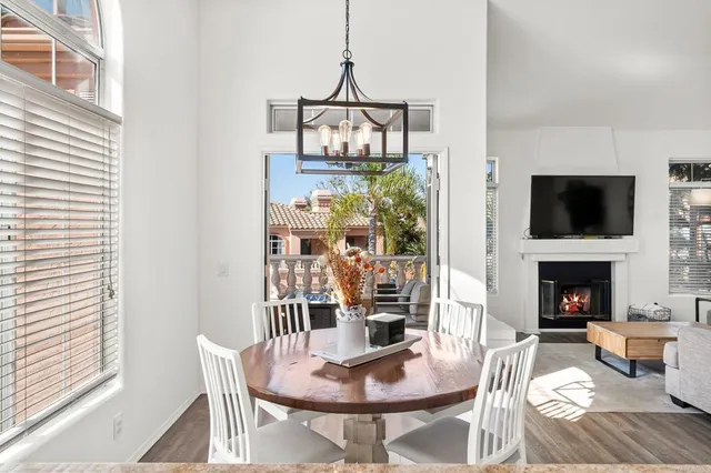 a living room with fireplace furniture and a flat screen tv