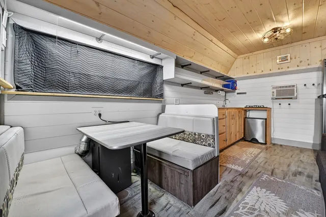 a kitchen with stainless steel appliances a sink and cabinets