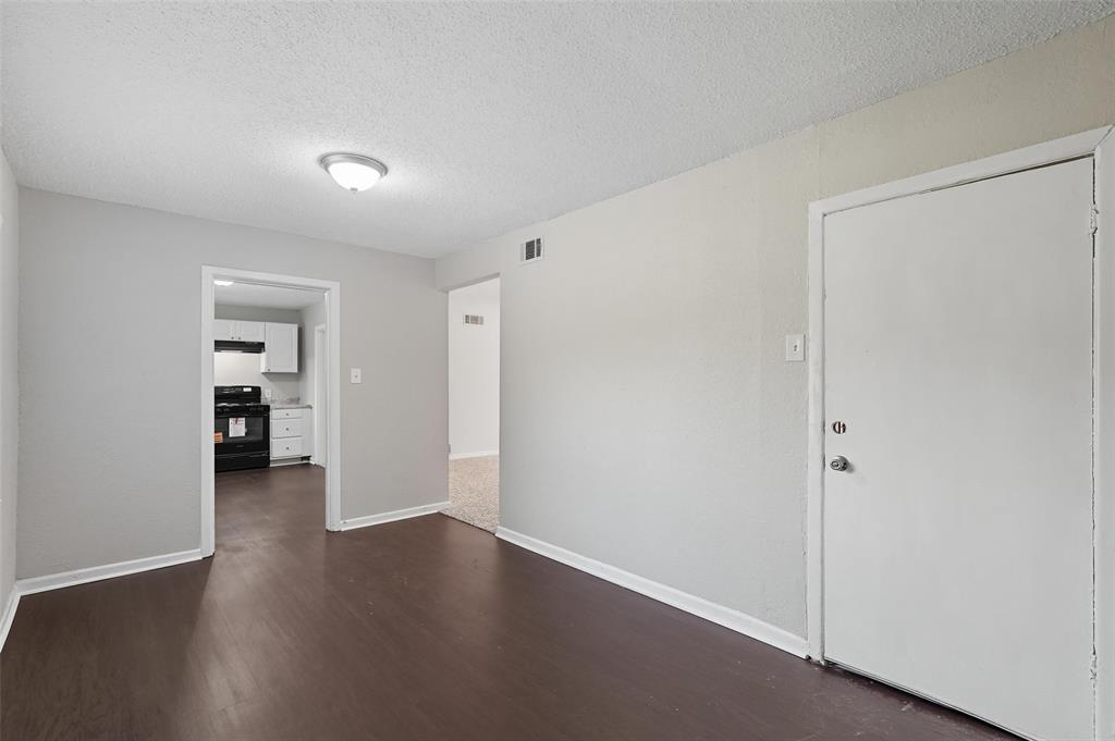 3211 Gus Thomasson Road Dallas, TX 75228 - Photo 13 of 23 a view of a big room with wooden floor and closet
