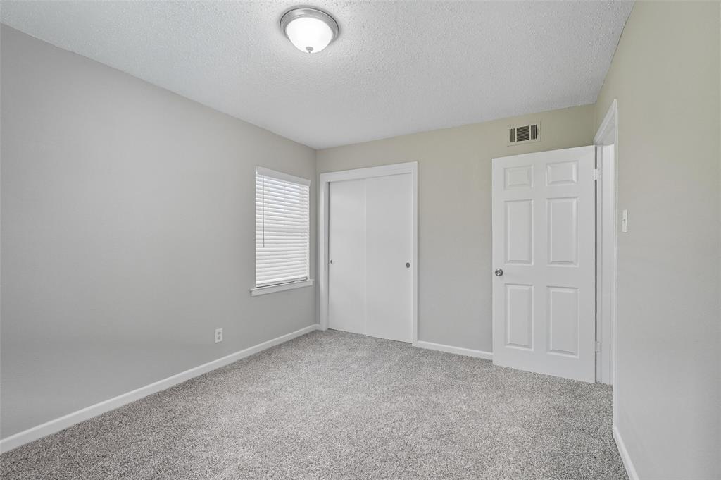3211 Gus Thomasson Road Dallas, TX 75228 - Photo 18 of 23 an empty room with windows and closet