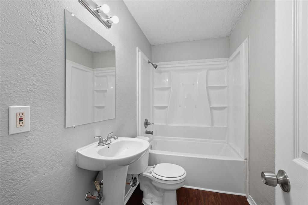 3211 Gus Thomasson Road Dallas, TX 75228 - Photo 19 of 23 a bathroom with a sink toilet and shower