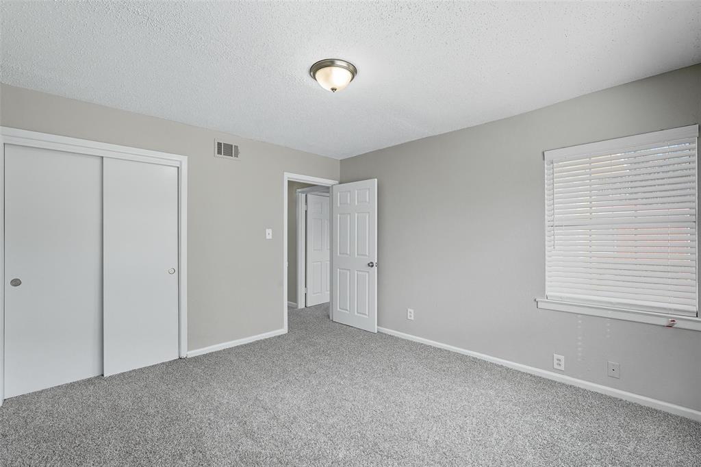 3211 Gus Thomasson Road Dallas, TX 75228 - Photo 20 of 23 a view of an empty room with a window