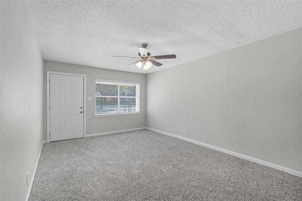 3211 Gus Thomasson Road Dallas, TX 75228 - Photo 2 of 23 an empty room with windows and fan