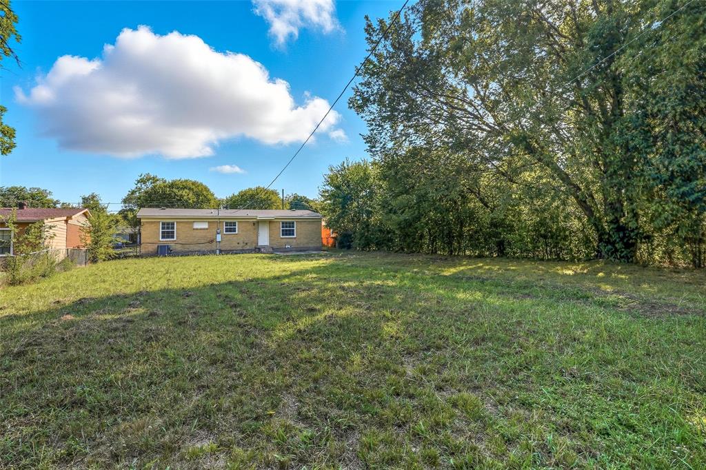 3211 Gus Thomasson Road Dallas, TX 75228 - Photo 22 of 23 a view of a house with a big yard