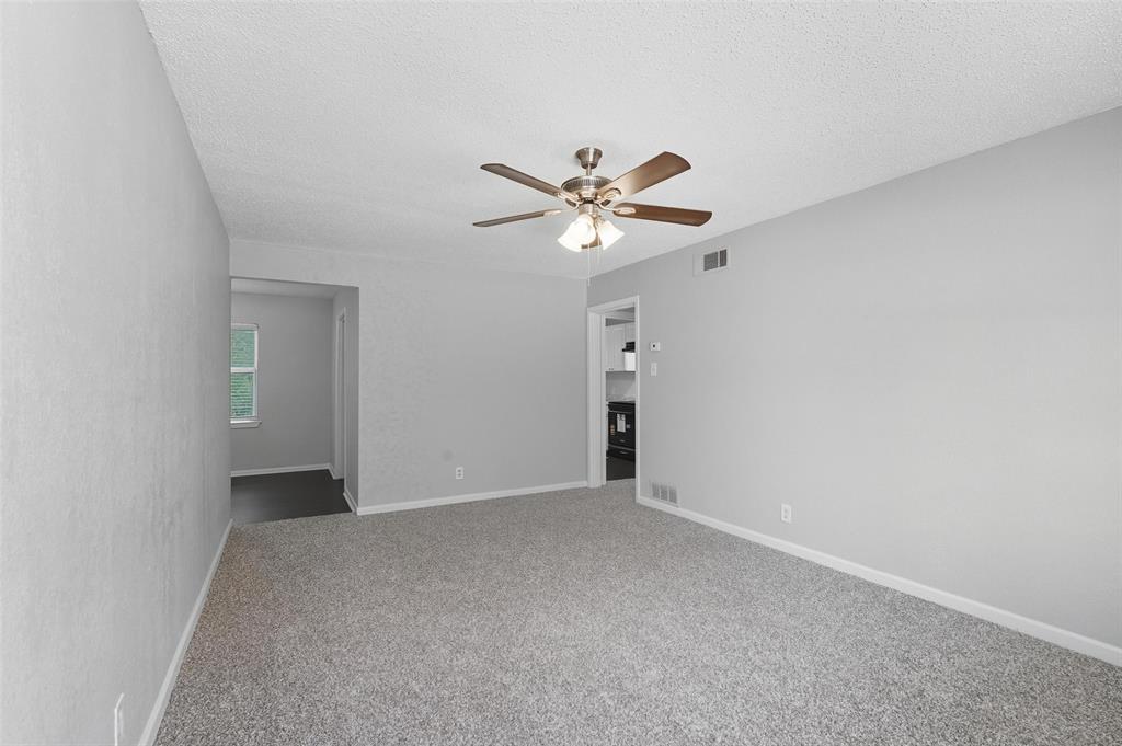 3211 Gus Thomasson Road Dallas, TX 75228 - Photo 3 of 23 a view of an empty room with a fan