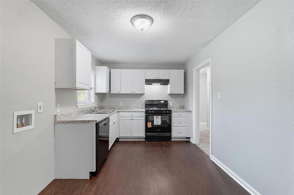 3211 Gus Thomasson Road Dallas, TX 75228 - Photo 6 of 23 a kitchen with a refrigerator stove and sink
