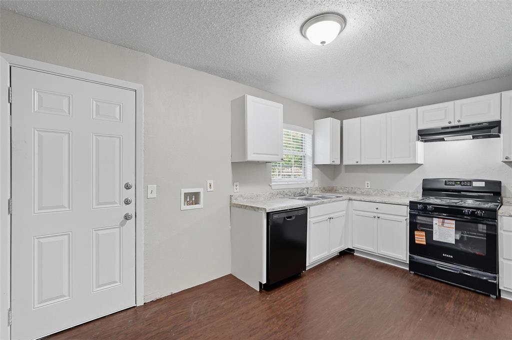 3211 Gus Thomasson Road Dallas, TX 75228 - Photo 8 of 23 a kitchen with stainless steel appliances granite countertop a stove and a sink