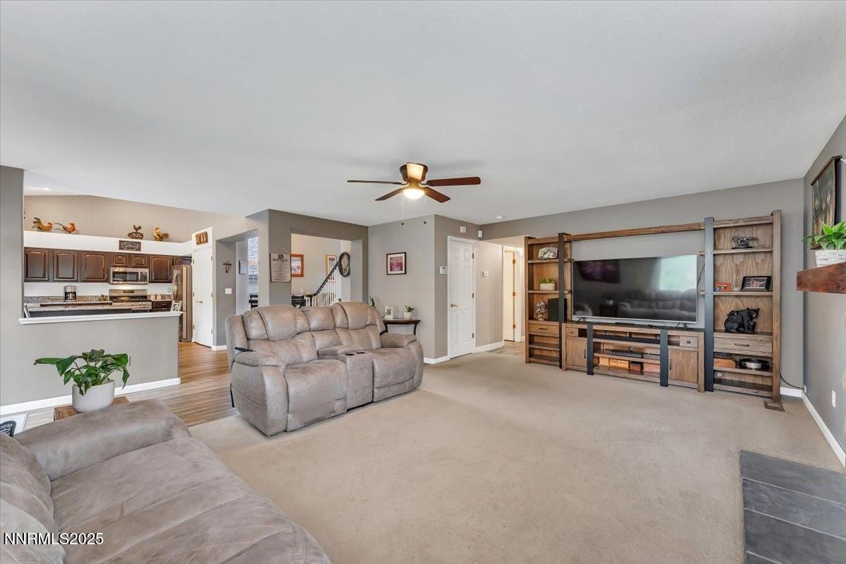 55 Ghost Rider Court Reno, NV 89511 - Photo 12 of 29 a living room with furniture and a flat screen tv